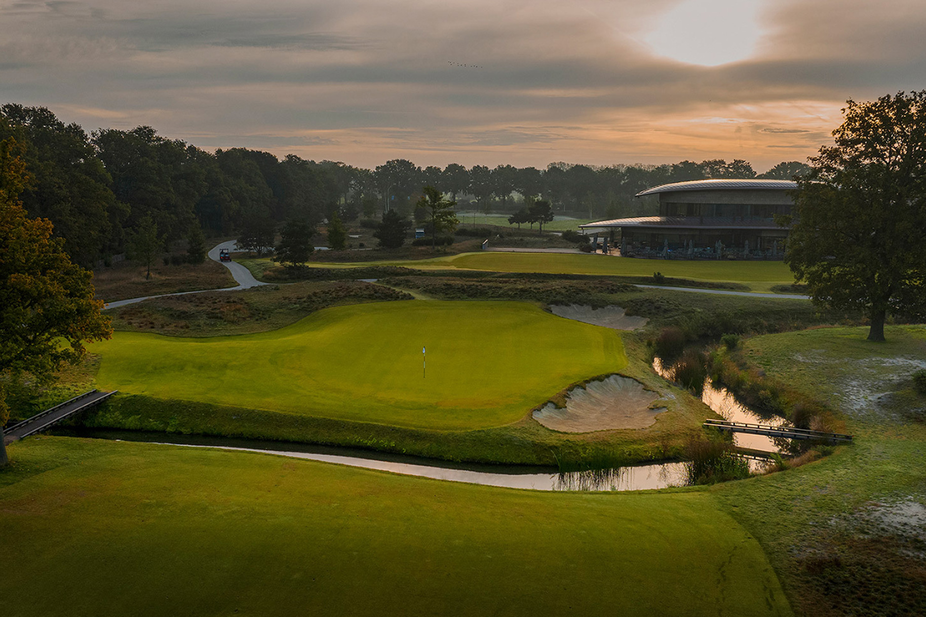 Robert van der Wallen and Ben Pon in a golf cart